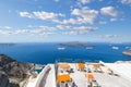 View from a public viewing area above a terrace of the cruise port, caldera, ships and outer islands of Santorini, Greece Royalty Free Stock Photo