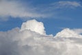 Puffy rain clouds in a blue sky Royalty Free Stock Photo