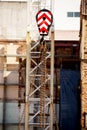 View of the pulley and chain hanging from a large crane