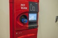 View of putting plastic bottle to recycling automatic machine.
