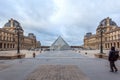 View Pyramid at courtyard of Paris Louvre Museum. Louvre Museum is one of the largest and most visited museums worldwide