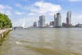 A view of the quay of the river Maas and the imposing buildings at the Erasmus bridge