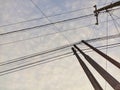 View of a quiet village with blue sky and power lines overhead.