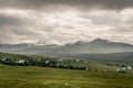 A view of Quirang hiils in the distance from the walking path from Staffin village to Staffin harbour and An Corran Beach Royalty Free Stock Photo