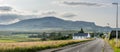 A view of Quirang hiils in the distance from the walking path from Staffin village to Staffin harbour and An Corran Beach Royalty Free Stock Photo