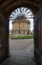 The view of Radcliffe Camera through the gate of University church. Oxford University. England Royalty Free Stock Photo