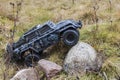 View of radio controlled model racing car military on off-road background. Toys with remote control. Free time.