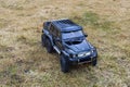 View of radio controlled model  racing car on off-road background. Toys with remote control. Free time. Children and adults conce Royalty Free Stock Photo