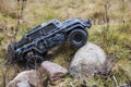 View of radio controlled model  racing car on off-road background. Toys with remote control. Free time. Royalty Free Stock Photo