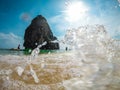 View of Railay beach in Krabi, Thailand from the see. Picture taken with action cam with a wave hitting it.