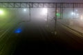 View of the railway from the bridge at night in the fog Royalty Free Stock Photo