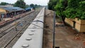A View of the Railway Station from the Over Bridge of the Indian Railways. Indian train is standing on the platform.