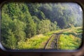 A view of the railway tracks through the train window. Horizontal frame Royalty Free Stock Photo