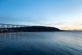 View of the 1908 railway trestle bridge and its reflection in the St. Lawrence River