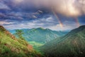 View of rain clouds double rainbow and tree in Altai Royalty Free Stock Photo