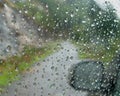 A view of rain drops on the car window pane during the South-West Monsoon, Kerala, India Royalty Free Stock Photo