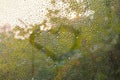 View of Rain drops on window with green,red and yellow color tree in background Autumn Abstract blurred Backdrop Royalty Free Stock Photo