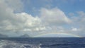 View of rainbow against blue sky with clouds in Indian Ocean, Mauritius Island Royalty Free Stock Photo