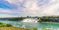 View at the Rainbow International bridge over Niagara river with American falls and Bridal Veil falls at USA territory.