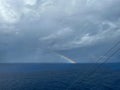 A view of a rainbow after a storm on the Caribbean Sea from a cruise ship Royalty Free Stock Photo