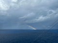 A view of a rainbow after a storm on the Caribbean Sea from a cruise ship Royalty Free Stock Photo