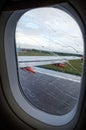 View of rainy airplane window during takeoff