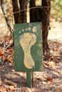 DEFACEMENT OF A HIKING SIGN BY RANDOM GRAFITTI