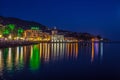 View of Rapallo, Genoa province and the castle on the sea by night, Italy Royalty Free Stock Photo