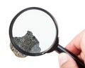 View of raw peridotite stone through magnifier