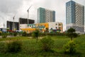 View of the recently built municipal kindergarten against the backdrop of new and under construction houses in the Preobrazhensky