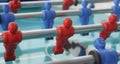 A view on red and blue plastic table football players Royalty Free Stock Photo