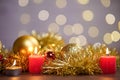 View of red candle lights of with Christmas ornaments on the table with bokeh background Royalty Free Stock Photo