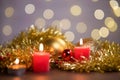 View of red candle lights of with Christmas ornaments on the table with bokeh background Royalty Free Stock Photo