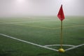 The view from the red corner flag on a football field in fog Royalty Free Stock Photo