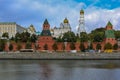 View of the red Kremlin wall, tower and golden onion domes of cathedrals over the Moskva River in Moscow, Russia Royalty Free Stock Photo