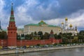 View of the red Kremlin wall, tower and golden onion domes of cathedrals over the Moskva River in Moscow, Russia Royalty Free Stock Photo