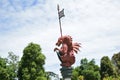 medieval dragon statue with spear, shield and flag