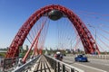 View of the red Picturesque bridge over the Moscow river with cars and cyclists. Moscow,