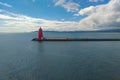 View of the red Poolbeg lighthouse in the sea. Royalty Free Stock Photo