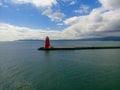 View of the red Poolbeg lighthouse in the sea. Royalty Free Stock Photo