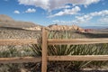 A wooden fence in the desert with mountain view Royalty Free Stock Photo