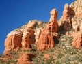 A View of Red Rocks, Blue Sky, and Green Trees