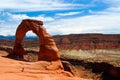 View on red  red sandstone arch with rugged stone valley background - Delicate arch, Arches national park, Utah Royalty Free Stock Photo