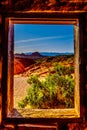 View of the red sandstone rock formations from one of the windows in the historic sandstone cabins in the Valley of Fire in NV USA Royalty Free Stock Photo