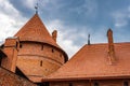 View of the red tiled roof and red brick masonry of the towers of Trakai Castle, Trakai, Lithuania Royalty Free Stock Photo