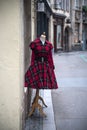 red vintage gothic dress on hanger in the street