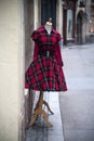 red vintage gothic dress on hanger in the street