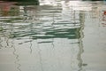 REFLECTION OF MASTS OF BOATS IN WATER Royalty Free Stock Photo