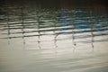 REFLECTIONS OF MASTS IN HARBOUR WATER Royalty Free Stock Photo