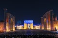 View of Registan square in Samarkand at night with a laser show on the history of the East